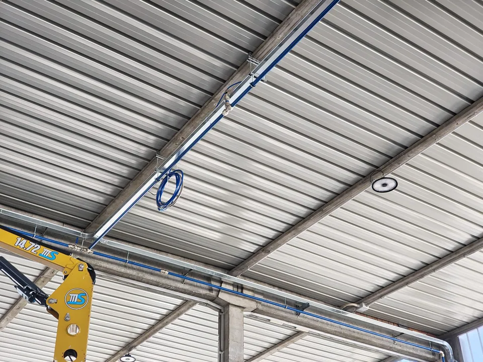 Main distribution line fixed with brackets to the roof structure