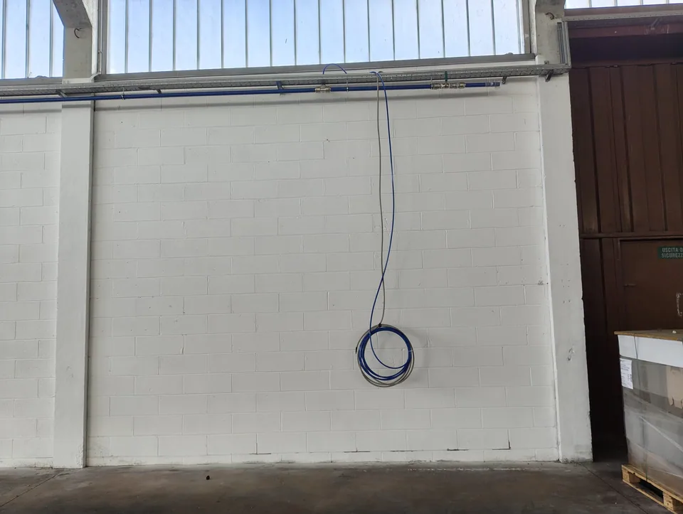 Compressed air drop from the main line down the warehouse wall