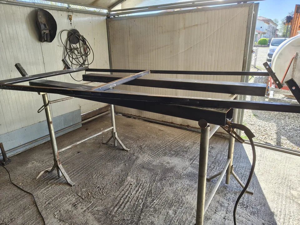 Parts of the support frame being made on trestles in the workshop