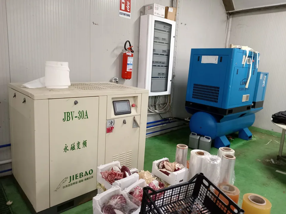 Plant room with compressor, dryer and wall-mounted electrical panel