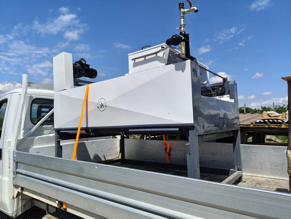 Finished machine secured on the flatbed, ready for delivery